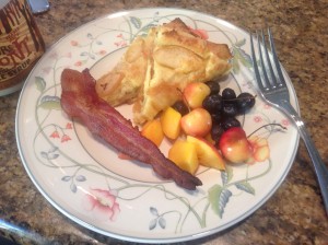 Slice of apple Dutch baby for breakfast